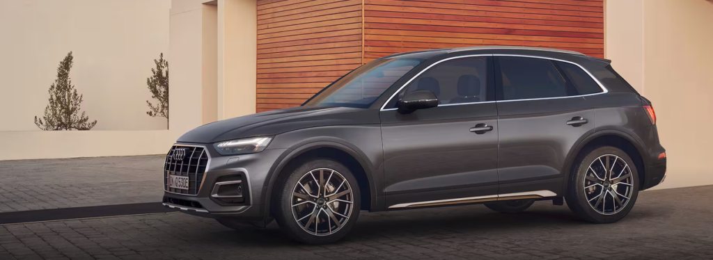 A grey family Audi Q5 is parked outdoors.