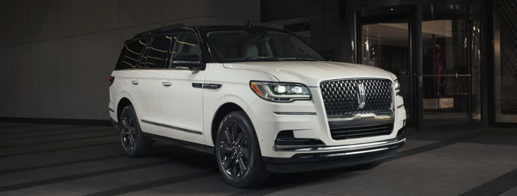 A shiny white Lincoln Navigator is the perfect luxury car for families.