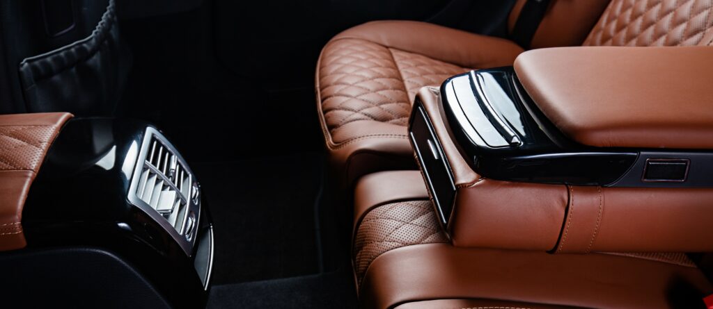 The sleek, leather interior of a luxury car, which is a good choice for professionals